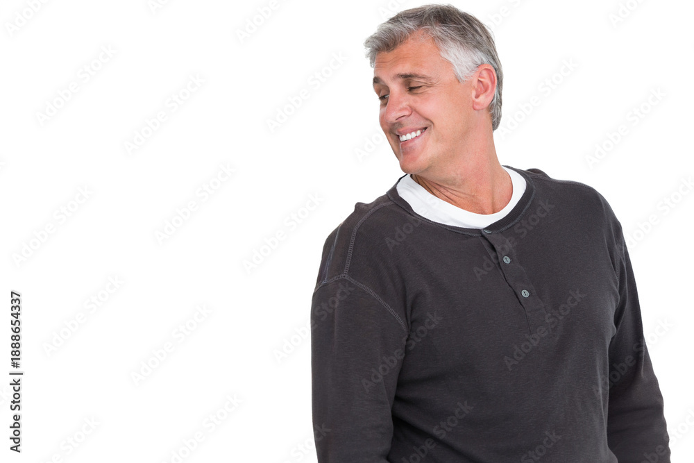 Fototapeta premium Senior man posing torso-up in studio smiling turning head left henley and undershirt, copy space
