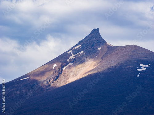 Close-up view of the sharp summit of Hokkaido Komagatake with sunlight hitting the peak (Hokkaido, Japan)