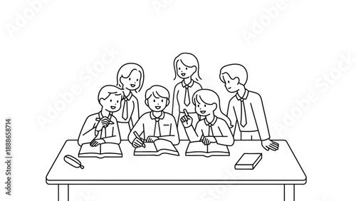 A group of students and teachers sitting at a desk with books and pencils