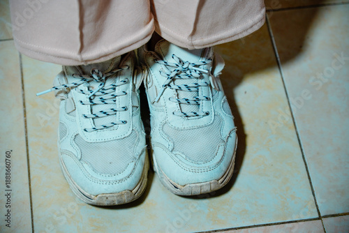 Quadro su tela A casual look featuring chunky white sneakers with thick soles paired with loose trousers with space for text