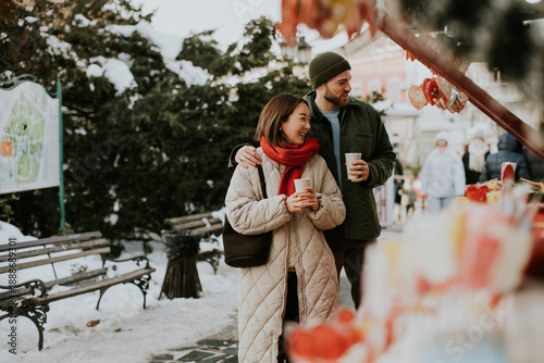 Couple enjoying winter mark...
