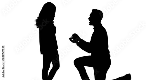 A romantic moment captured as a man proposes marriage to his beloved woman on one knee