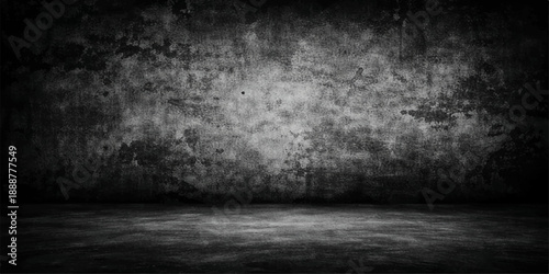 An empty dark room featuring an aged gray concrete wall with a rough grunge texture and a vintage stone floor backdrop