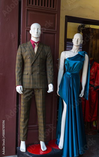 Fashion storefront display with male and female mannequins