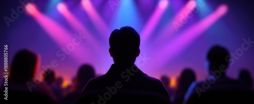 Audience immersed in a cinematic experience with vivid colorful theater lighting