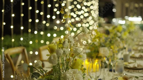 Close up flowers candle tablecloth catering dinner. Wedding set up bouquet event party reception night outdoor. 