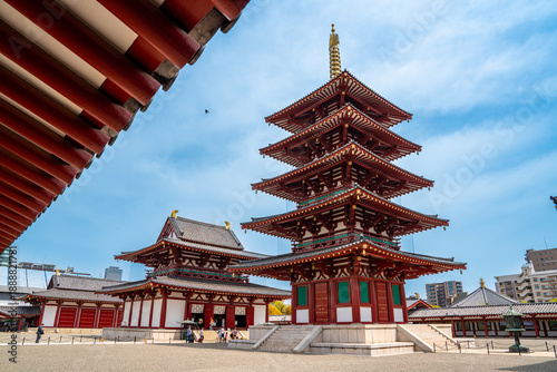 Shitennō-ji Buddhist temple, Osaka, Japan. Famous buddhist temple with a five story pagoda, statues and japanese zen garden, first built in 593 d.C.