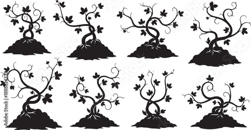 Set of black silhouettes of trees on small mounds
