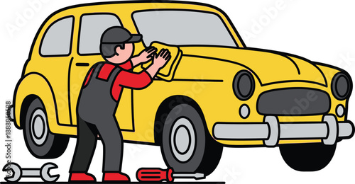 Automotive technician wearing overalls cleans the hood of a yellow vintage car using a yellow cloth near a screwdriver and wrench.