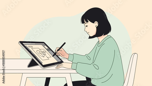 Young woman drawing digital art on a tablet at home.