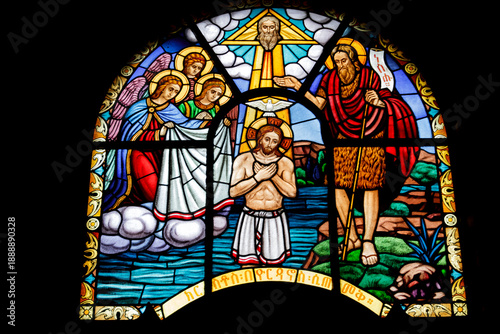 Vibrant Stained Glass Window Depicting the Baptism of Jesus Christ