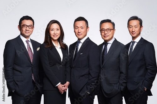 Confident business team standing together in formal attire