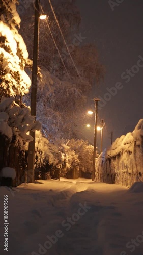 Snowy alley at night.