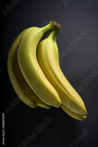 Wallpaper Mural beautiful banana branch photographed on a black background Torontodigital.ca