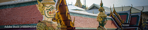 Photos Two yaksha statues from the Ramakien epic guard the gates of Wat Phra Kaew in Bangkok
