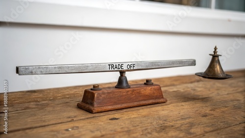 Trade Off Concept with Balance Scale and Bell on Wooden Tabletop