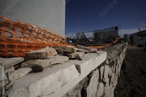 Fényképezés Ostia, Rome, Italy - January 25, 2026, detail of a section of a retaining wall in opus incertum travertine with perspective view