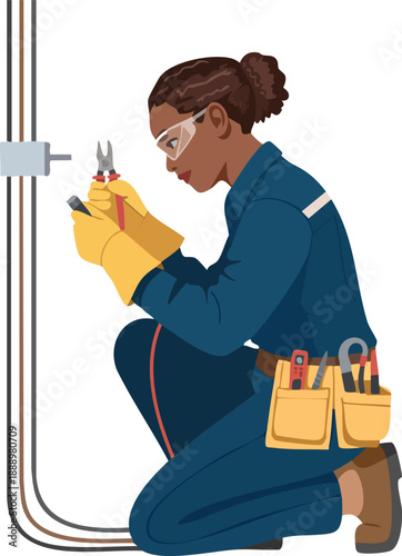 A focused female electrician in safety gear working on electrical wiring with pliers.