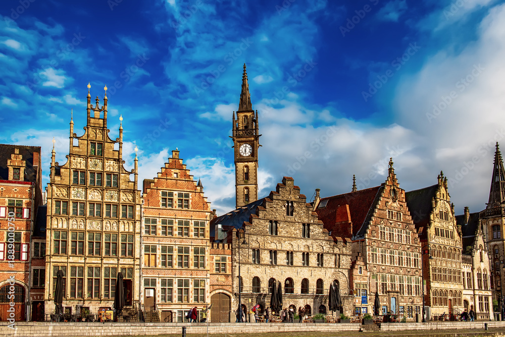 Obraz premium Ghent city historical center, tourists boats and colorful buildings on Leie river bank, Belgium