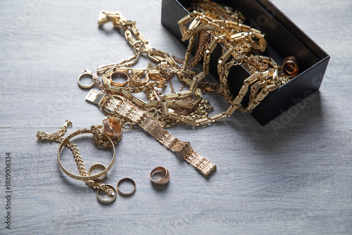Картината върху платно Box of golden jewelry on the table.