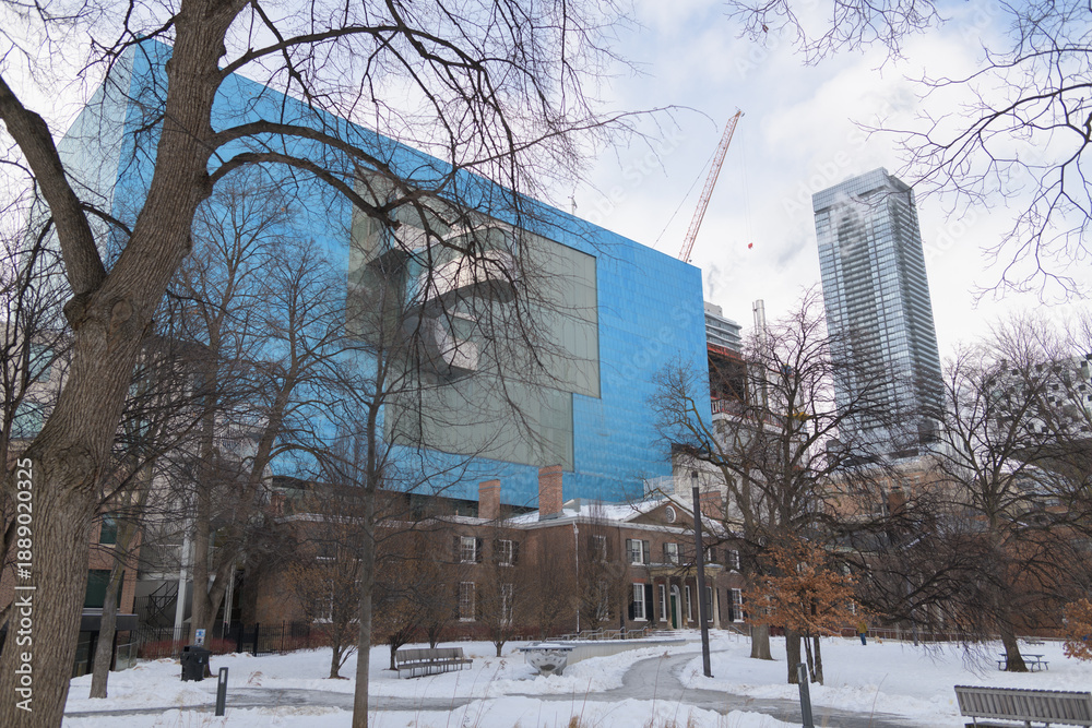 Fototapeta premium winter in Grange Park, and a view of Frank Gehry's Blue Box, historic Grange house, in Toronto