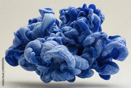 A sculpted, cloud-like form of blue and white swirling fabric against a plain backdrop