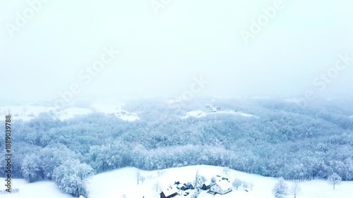 Aerial Winter Landscape Covered in Snow and Fog