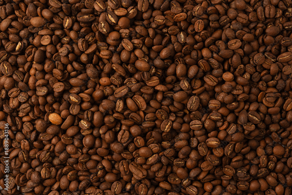 Fototapeta premium Coffee beans on a white background. Coffee beans texture.