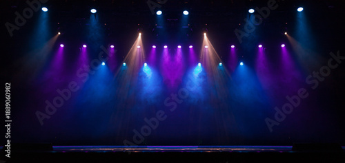 An empty stage of the theater, lit by spotlights and smoke before the performance