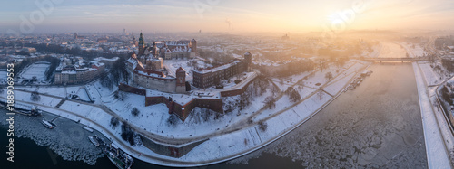 Wawel Castle and Wawel cathedral aerial view over frozen Vistula river on the cold winter morning