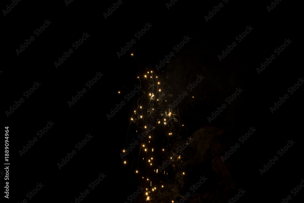 Obraz premium VFX Bright Orange Fire Sparks Flying on Black Background for Compositing Matte Painting Cinematic Visual Effects Overlay Textures