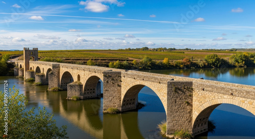 Wallpaper Mural Ancient stone bridge over calm river in countryside landscape Torontodigital.ca