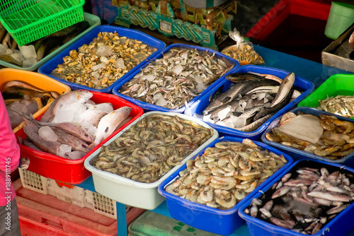 close up of various types of fresh fish in boxes in traditional markets