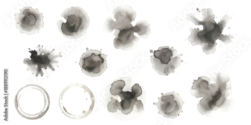 A collection of artistic grey watercolor stains and ink splatters for grunge design elements