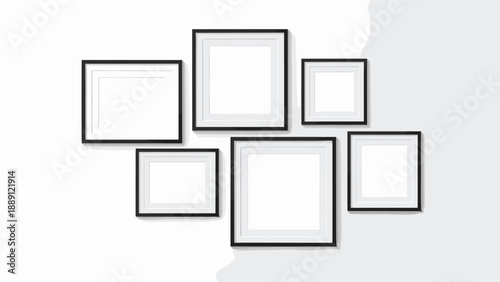 Arrangement of six empty black picture frames on a white wall provides a modern layout for displaying personal photos or artwork.