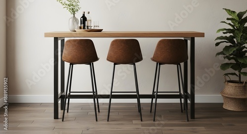 Modern high top bar table with three brown stools in a home setting