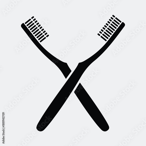 Crossed toothbrushes representing oral hygiene dental care symbol silhouette vector illustration