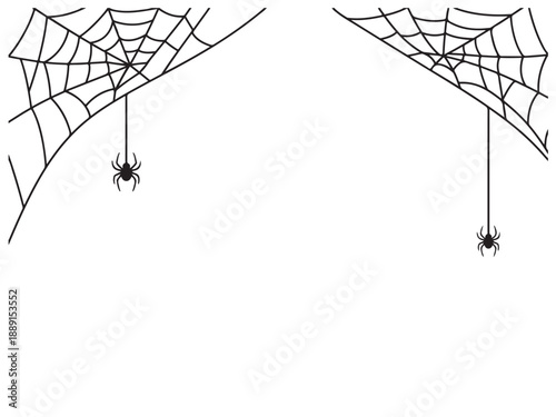 Spider web with spider hanging down from corner  two sets of cobwebs and spiders