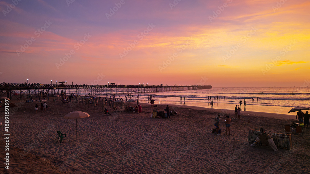 Fototapeta premium Panoramic aerial drone photo of a beautiful sunset over Pimentel, Chiclayo, northern Peru, a coastal tourism destination for travel and summer vacations