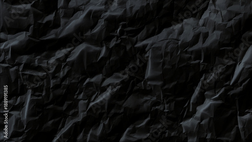 Black crumpled paper texture background with wrinkles