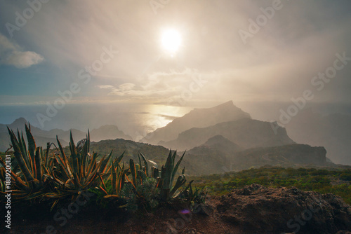 Beautiful sunset over the green volcanic landscape in Masca valley, Tenerife, Spain. Aerial view of Tenerife island landscape. Travel destination, Canary islands scenery