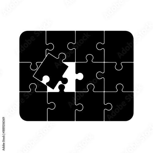 Black puzzle piece being placed into a complete jigsaw puzzle with