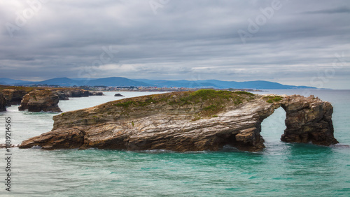 Majestic natural rock arches at Cathedrals Beach (Praia das Catedrais) in Ribadeo, Galicia, Spain.