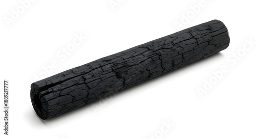 A single cylindrical stick of black charcoal with a textured surface on a white background.