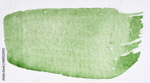 A single, broad brushstroke of light green watercolor paint is applied to white paper