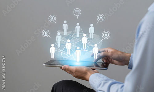 seated businessman holds sleek holographic display projecting map target audience personas integrated crm symbols
