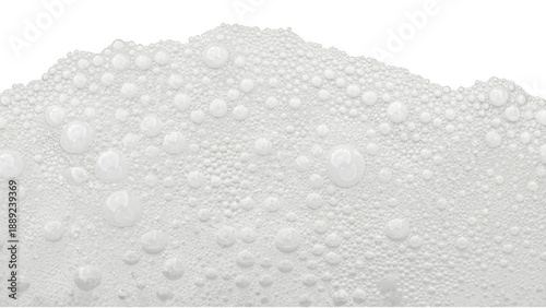 Macro shot of white foam texture with glossy water droplets on a dark solid surface