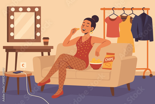 Woman enjoying snacks while sitting on a couch in a well-lit room with clothing items and a mirror nearby