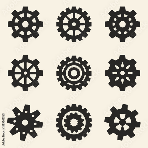 A set of black gear icons on a beige background for industrial or mechanical design