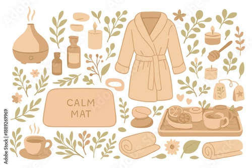 Relaxation activities at home with tea, candles, and essential oils on a mat with a bathrobe and leaves